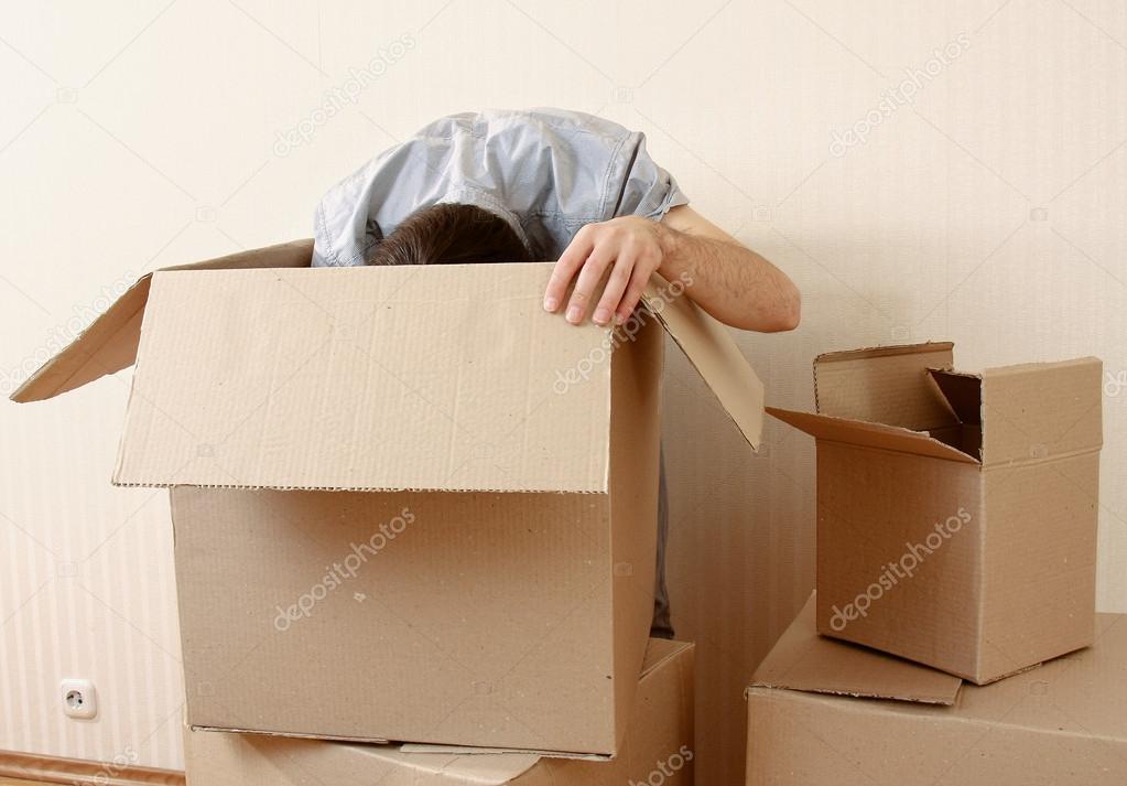 Man standing near boxes