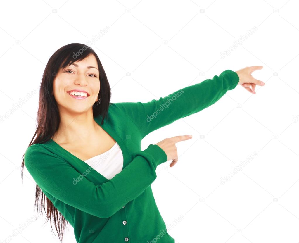 Young smiling woman points a hand
