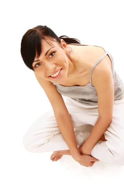 Young woman sitting on the floor — Stock Photo, Image
