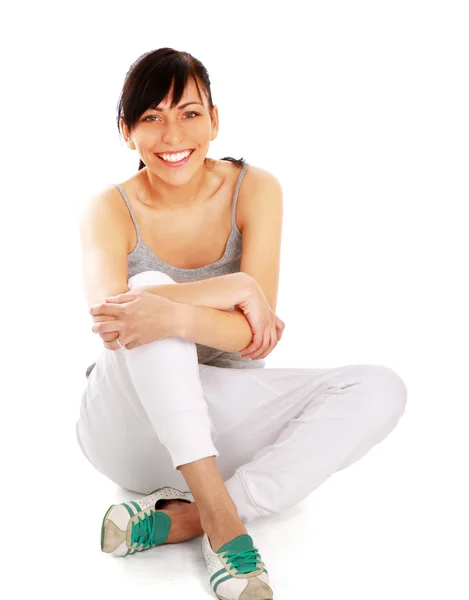 Young woman sitting on the floor — Stock Photo, Image