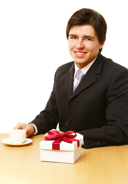 Empresario con un regalo — Foto de Stock