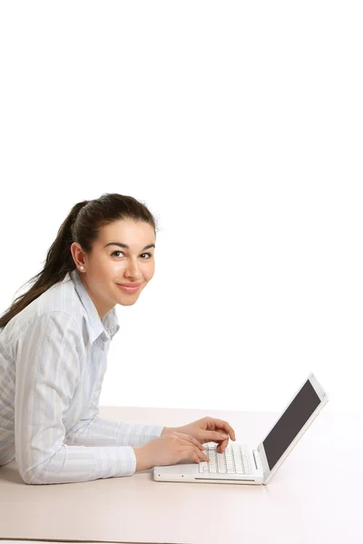 Girl with a laptop  lying on the floor — Stock Photo, Image