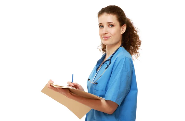 Portrait of a female doctor writing — Stock Photo, Image