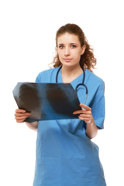 Female doctor examining an X-ray — Stock Photo, Image