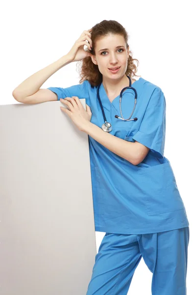 Female doctor with an empty board — Stock Photo, Image