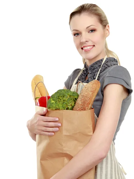 Woman holding a shopping bag full of groceries — Stock Photo, Image