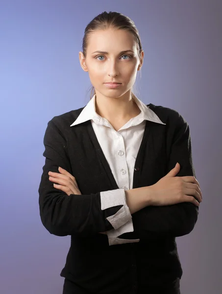 Businesswoman standing with folded arms — Stock Photo, Image