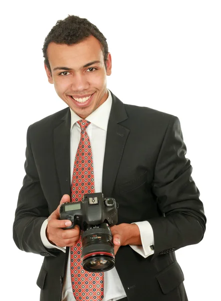 Beyaz arka plan üzerinde izole gülümseyen bir profesyonel fotoğrafçı — Stok fotoğraf