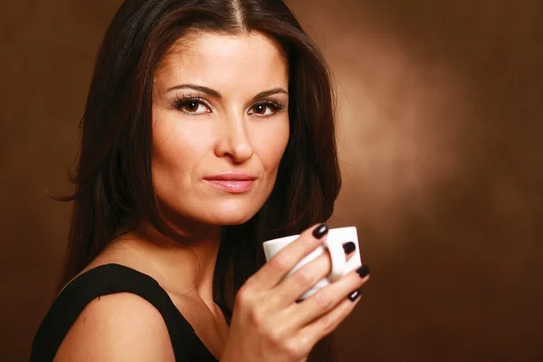 Woman with coffee in hands — Stock Photo, Image