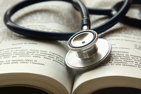 Stethoscope on a pile of books — Stock Photo, Image