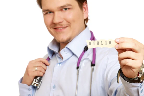 Doctor with piece of paper,word health — Stock Photo, Image