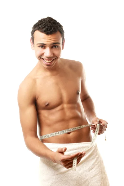 Nude man covering himself with a towel — Stock Photo, Image