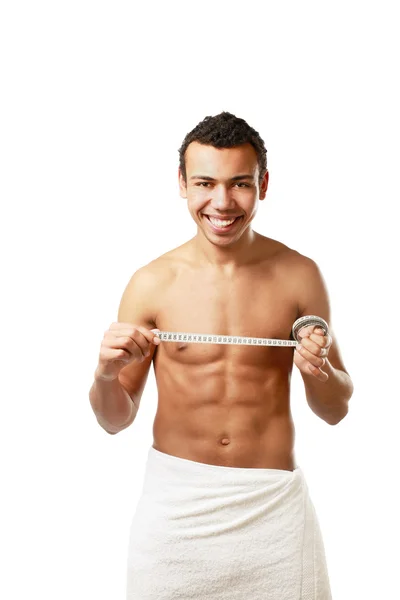 Nude man covering himself with a towel — Stock Photo, Image