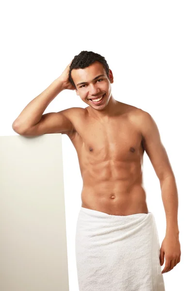 Nude young man standing near blank — Stock Photo, Image