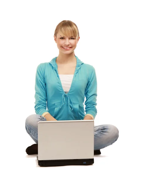 Girl sitting on the floor with a laptop — Stock Photo, Image