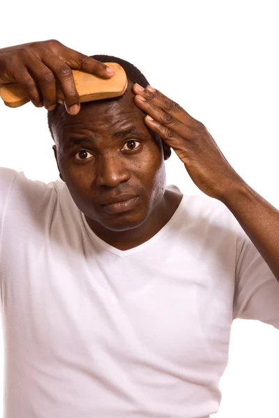 Afro man with comb — Stock Photo, Image