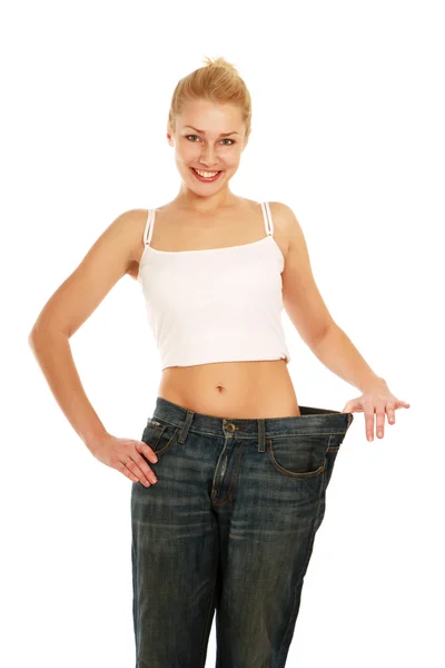 Young female's body in old jeans — Stock Photo, Image