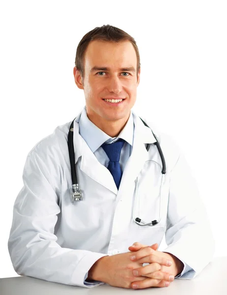 Doctor sitting at the desk Stock Image