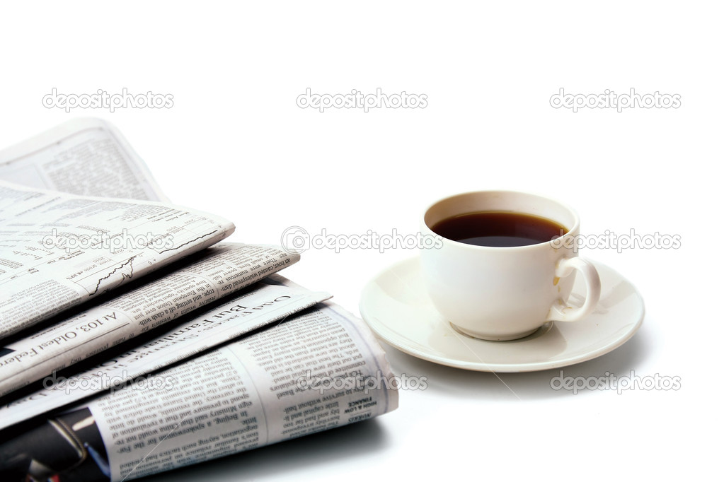 Coffee cup and newspaper