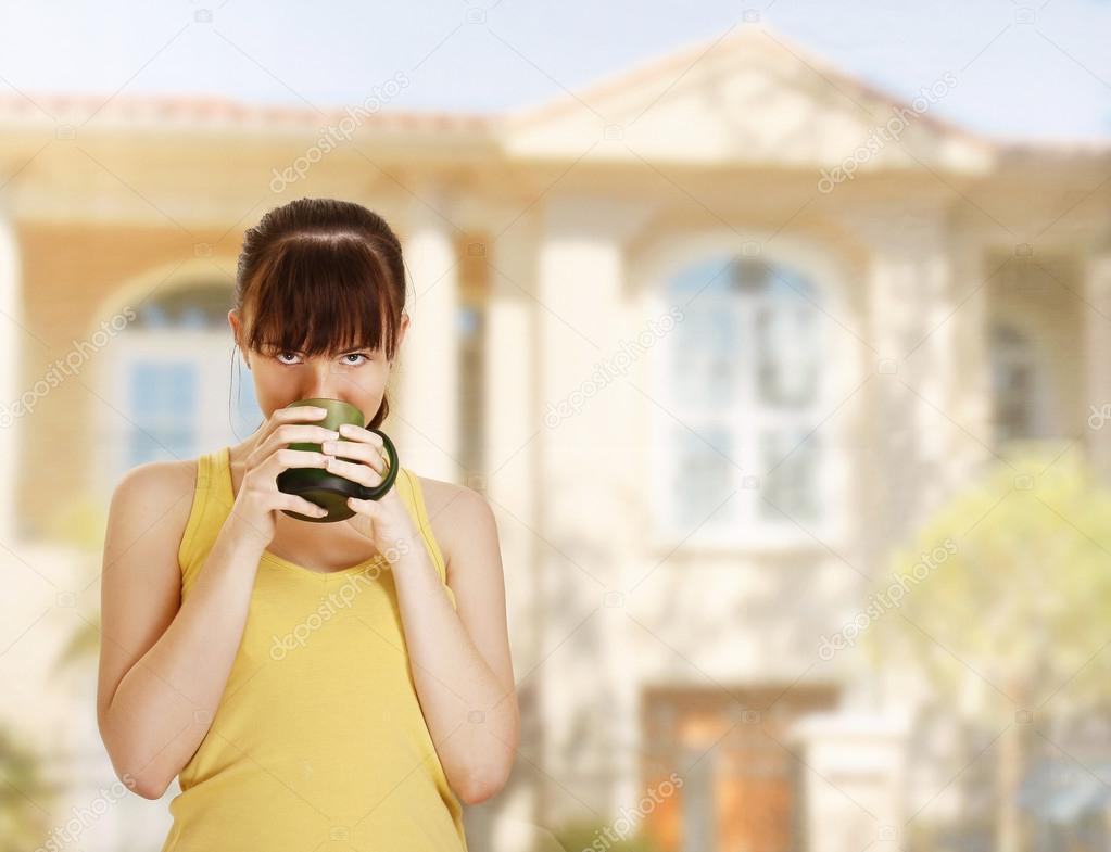 Beautiful woman drinks tea