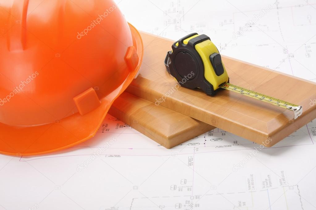 An orange hardhat with a ruler