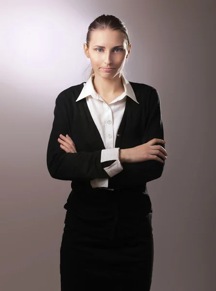 Business woman standing with folded arms — Stock Photo, Image