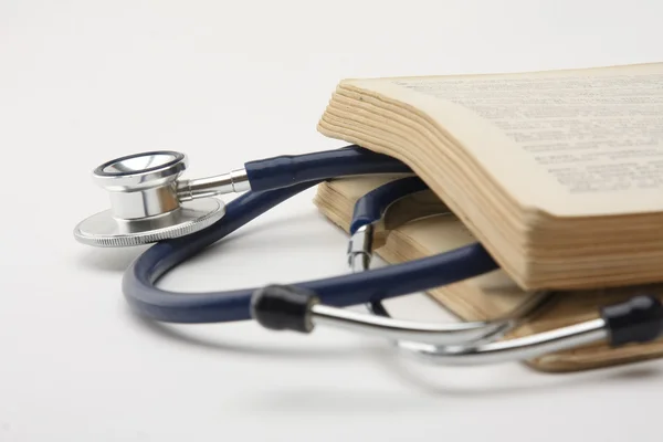 Stethoscope with open book — Stock Photo, Image