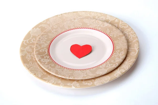 Red heart in plate — Stock Photo, Image