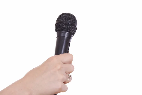 Black microphone in the hand — Stock Photo, Image