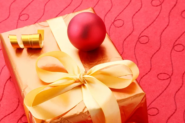 Gift box on red background — Stock Photo, Image