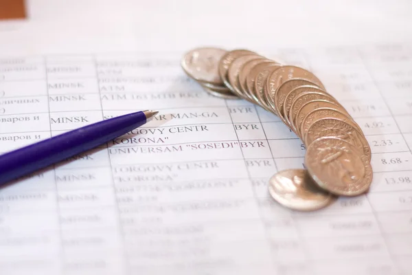 Coins, pen and business paper — Stock Photo, Image