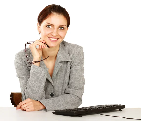 Businesswoman sitting on the desk — Stock Photo, Image