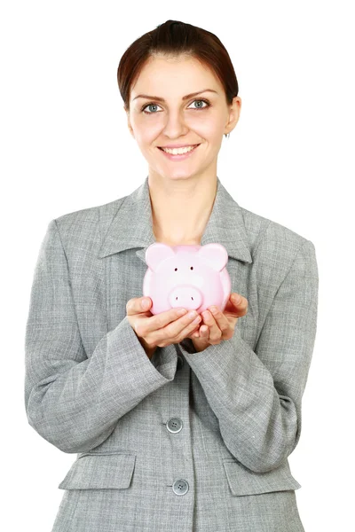 Frau steht mit Sparschwein — Stockfoto