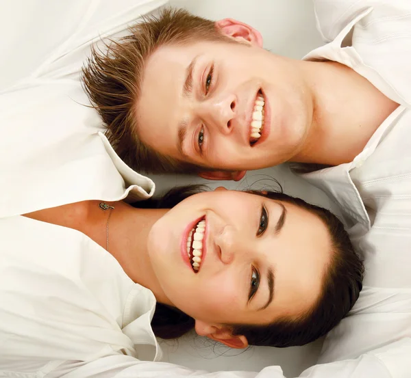 Young couple lying together — Stock Photo, Image