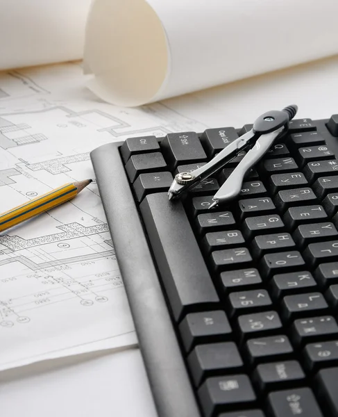 Pencil, dividers and blueprint on a laptop — Stock Photo, Image