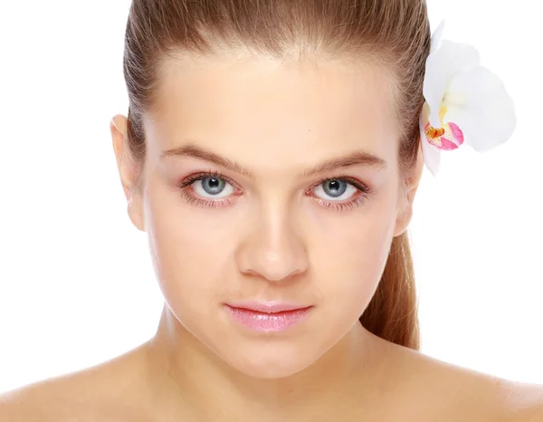 Woman with a flower in her hair — Stock Photo, Image