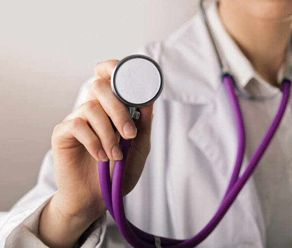 female doctor using stethoscope