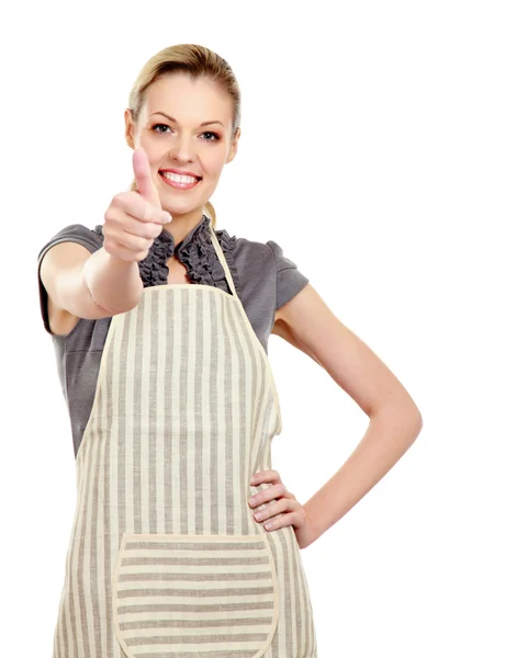 Mujer vistiendo delantal de cocina gestos pulgares hacia arriba — Foto de Stock