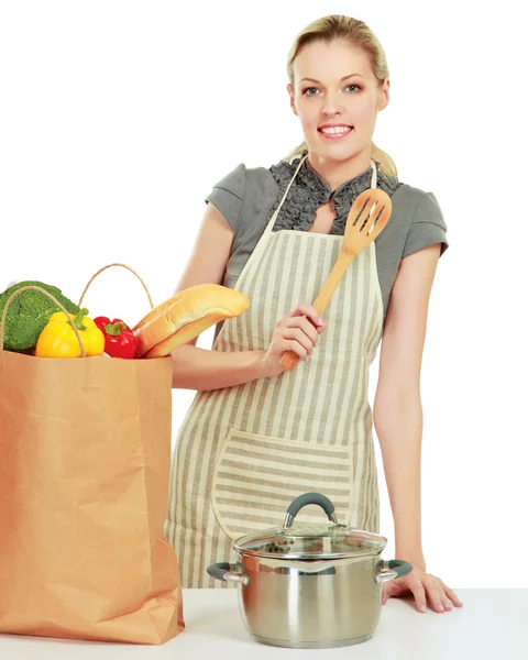 Woman in apron with grocery bag — Stock Photo, Image