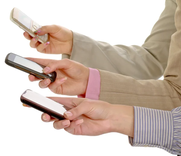 Business team holding mobile phones — Stock Photo, Image