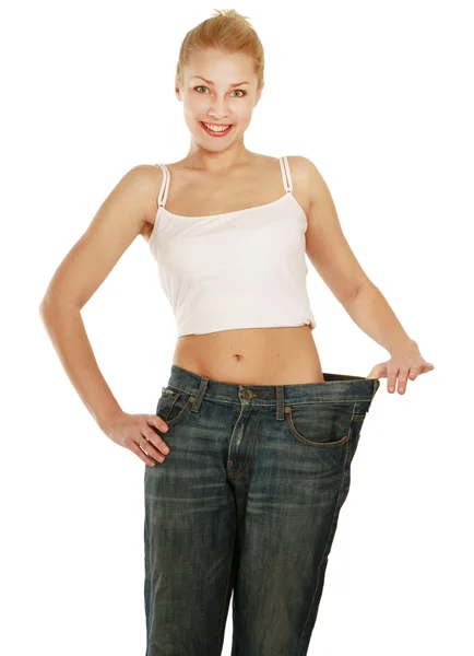 Žena ukazující, jak moc zhubla — Stock fotografie