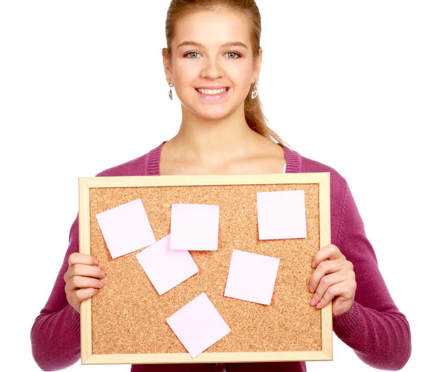 Young woman holding a board — Stock Photo, Image