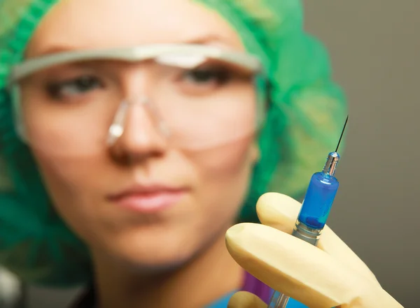 Medical doctor with syringe — Stock Photo, Image