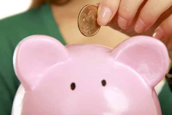 Young beautiful woman with piggy bank — Stock Photo, Image