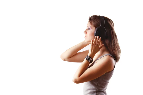 Girl listening music in headphones Royalty Free Stock Photos