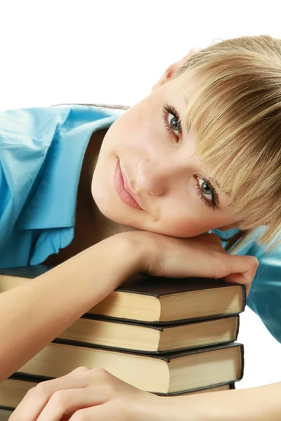 Young female student lying on books Stock Photo