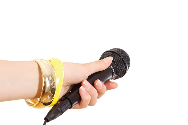 Ženská ruka drží mikrofon — Stock fotografie