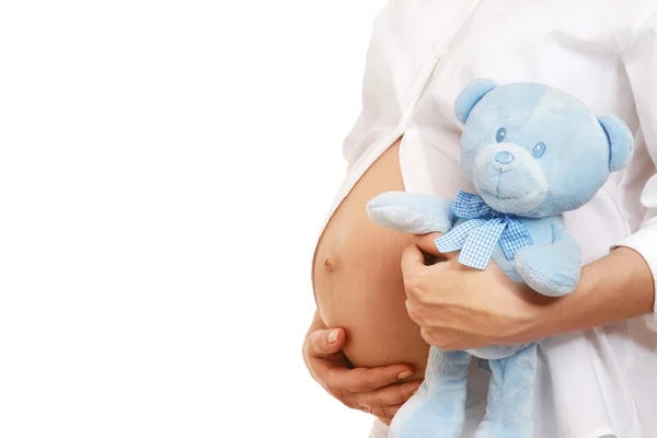Pregnant woman holding a toy — Stock Photo, Image