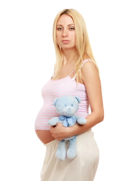 Pregnant woman holding a toy — Stock Photo, Image