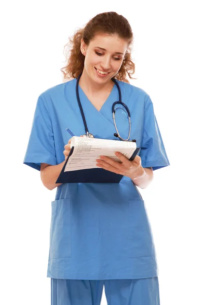 Female doctor with a clipboard — Stock Photo, Image